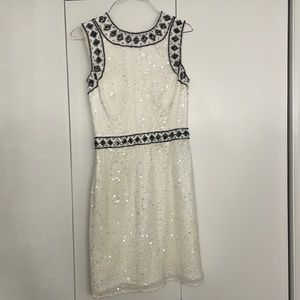 White sequins dress with black design